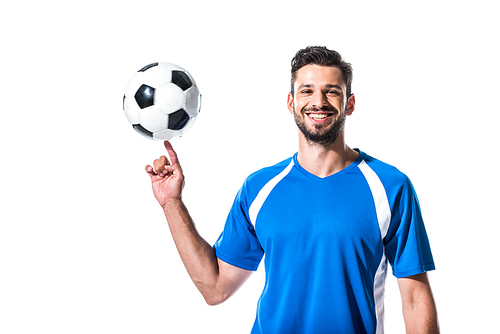 smiling handsome soccer player spinning on finger ball Isolated On White