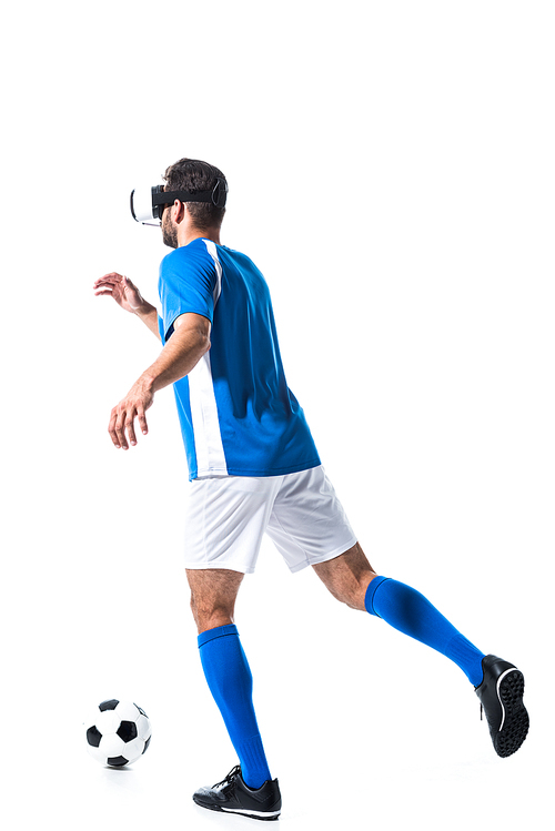 back view of soccer player in virtual reality headset training with ball Isolated On White