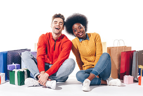 happy interracial couple with shopping bags and presents, isolated on white