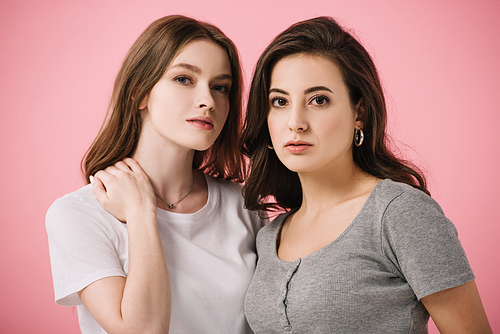 attractive women in t-shirts  isolated on pink