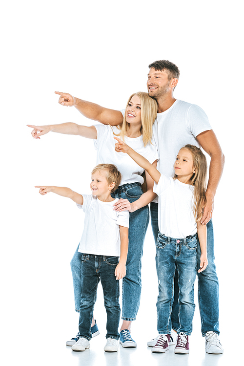 happy parents and kids pointing with fingers and looking away on white