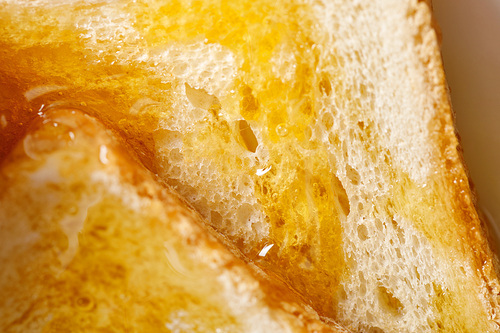 close up view of toasts with honey