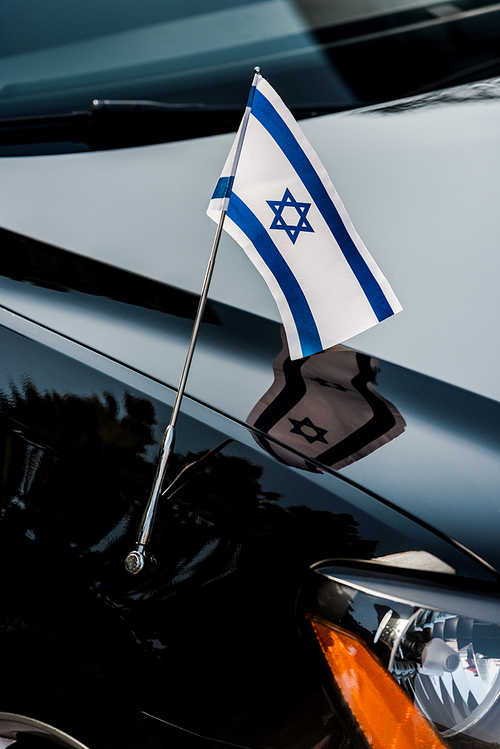 close up of israel flag with star of david on black car