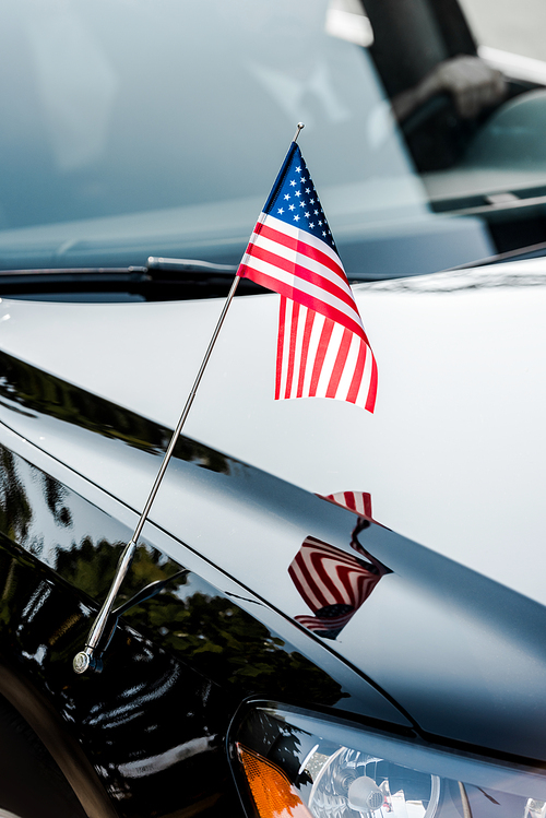 american flag with stars and stripes on black car