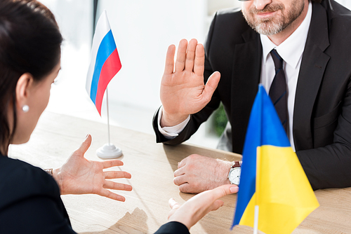 cropped view of ukrainian diplomat and ambassador of russia gesturing during negotiation