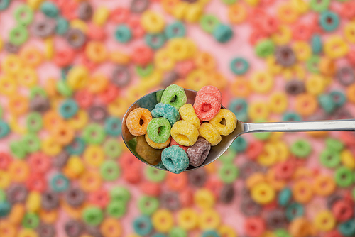 selective focus of bright colorful breakfast cereal in spoon