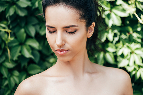 beautiful young and naked woman with closed eyes