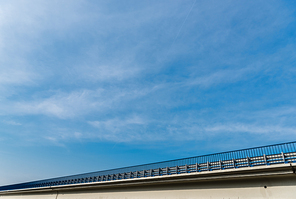 low angle view of bridge against sky with clouds