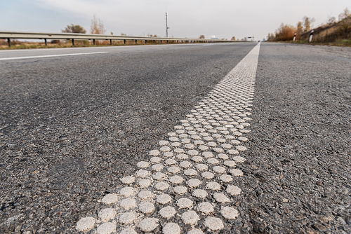 lane on grey asphalt on empty highway