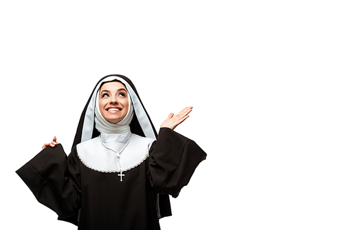 beautiful cheerful nun looking up with shrug gesture, isolated on white