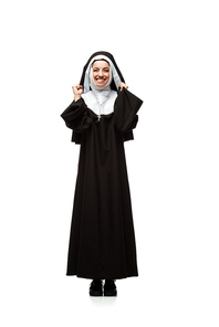 beautiful young excited nun standing isolated on white