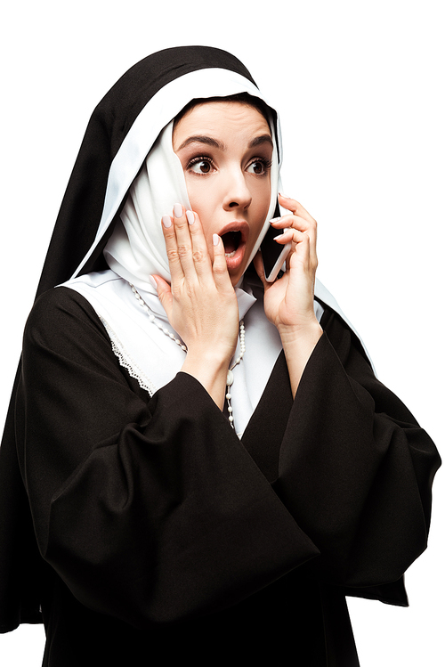 beautiful shocked nun talking on smartphone isolated on white