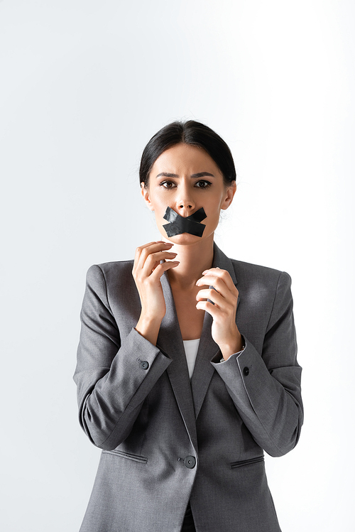 businesswoman with scotch tape on mouth  isolated on white, gender inequality concept