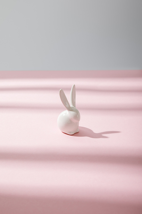 White decorative bunny on pink and grey