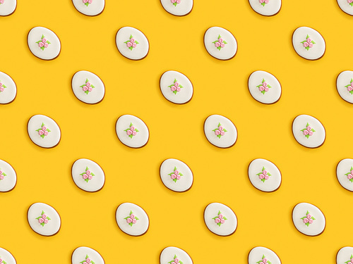 top view of . cookies isolated on yellow background, seamless pattern