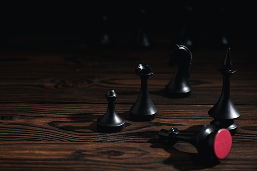 selective focus of chess figures on wooden surface