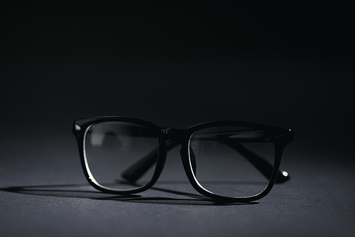 close up of glasses on black with copy space