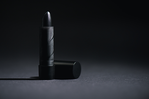 dark lipstick on black with copy space