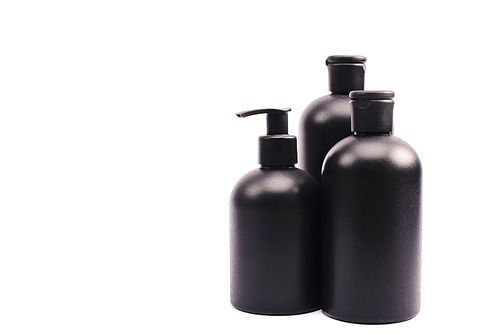 black bottles with body lotion isolated on white
