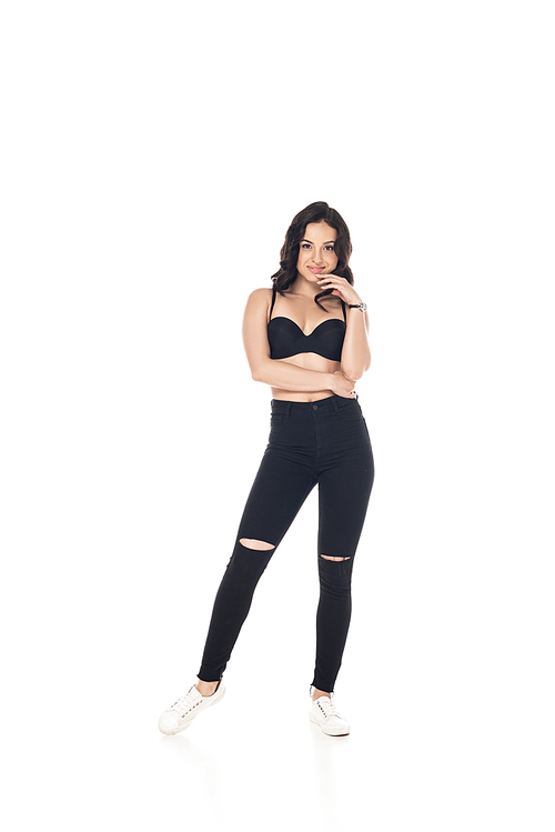 full length view of smiling sexy girl in black bra and pants isolated on white