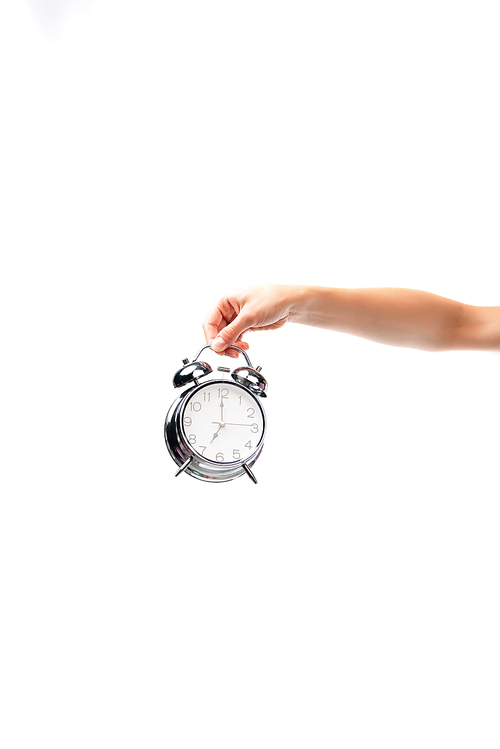 partial view of woman holding vintage alarm clock isolated on white