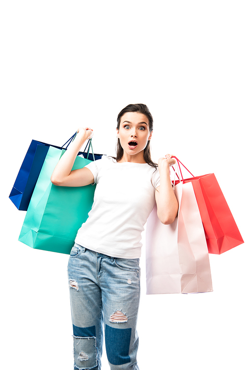 shocked woman holding shopping bags and  isolated on white