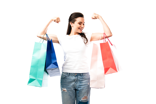 strong woman holding shopping bags isolated on white