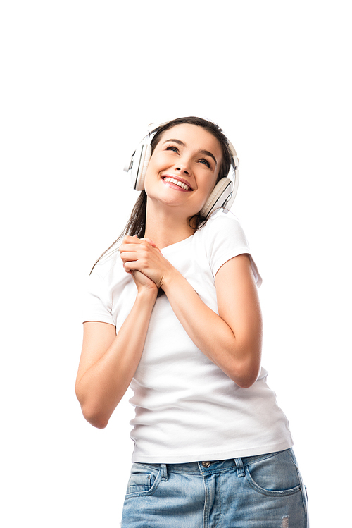 young woman in white t-shirt and wireless headphones isolated on white