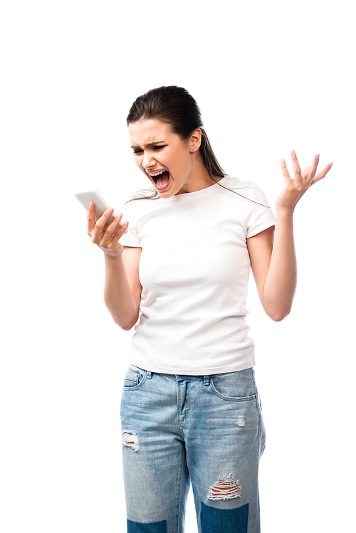 displeased woman screaming and holding smartphone isolated on white