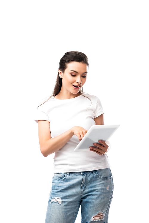 brunette woman in white t-shirt using digital tablet isolated on white