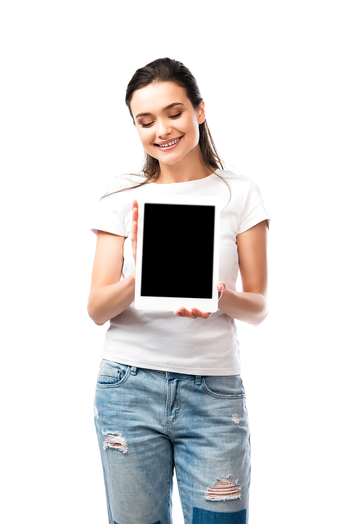 brunette woman in white t-shirt holding digital tablet with blank screen isolated on white