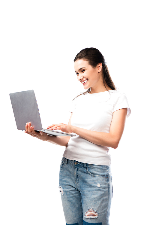 brunette woman in white t-shirt using laptop isolated on white