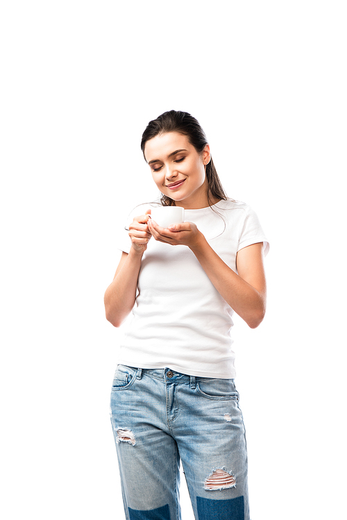 young brunette woman in white t-shirt holding cup with coffee isolated on white