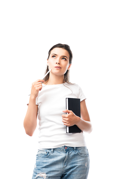 pensive woman in white t-shirt holding notebook and pen isolated on white