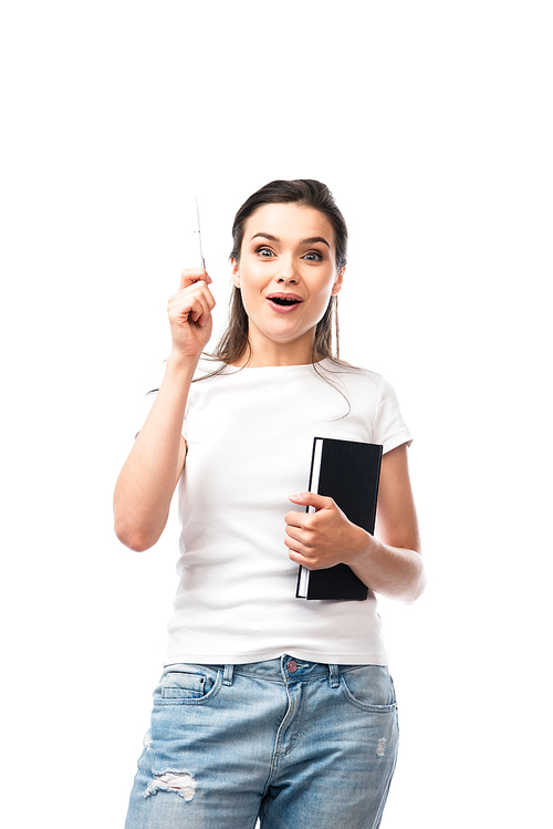 brunette woman in white t-shirt holding notebook and pen while having idea isolated on white