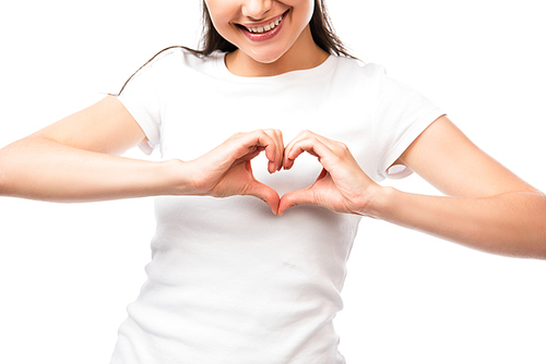 cropped view of young woman showing heart sign with hands isolated on white