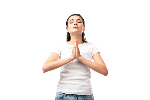 woman with closed eyes and praying hands isolated on white