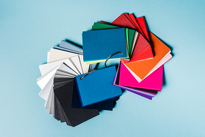 Top view of colorful swatches on blue background