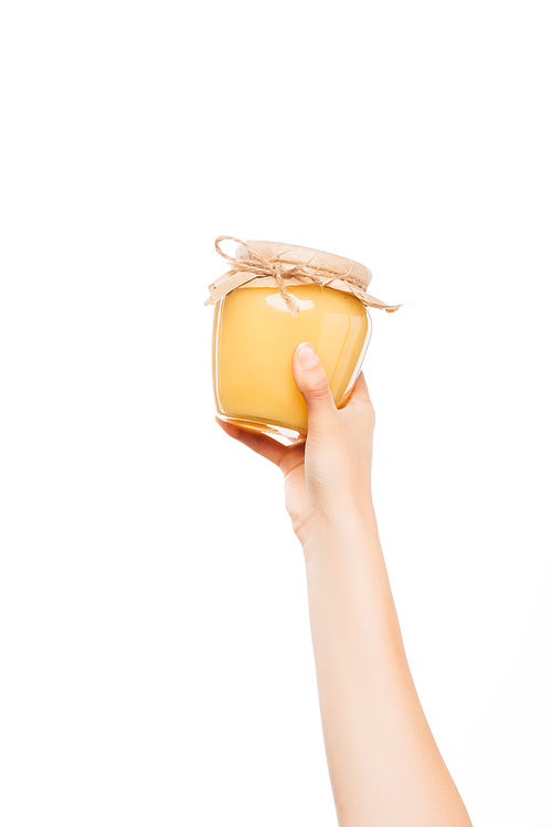 cropped view of woman holding jar of honey isolated on white, charity concept