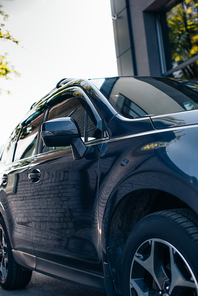 right side of black, polished modern car