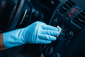 cropped view of car cleaner polishing control panel on dashboard