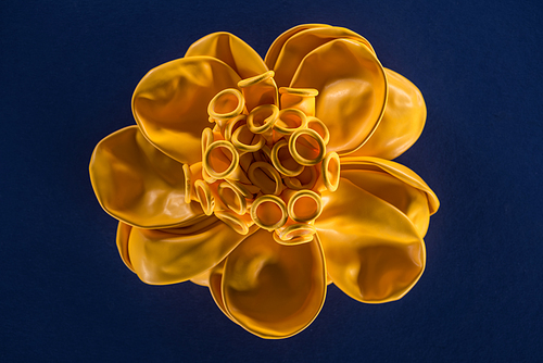 Top view of yellow balloons on dark blue background