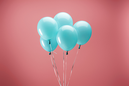 bright party decorative balloons on pink background