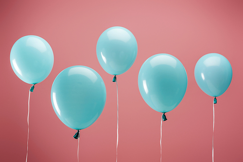 festive party decorative balloons on pink background