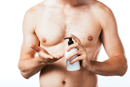 Cropped view of shirtless man holding bottle of lotion isolated on white