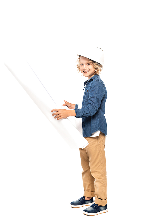 curly boy in safety helmet and costume of architect holding blueprint and  isolated on white