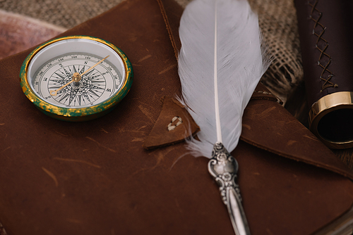 nib and compass on leather copy book on hessian