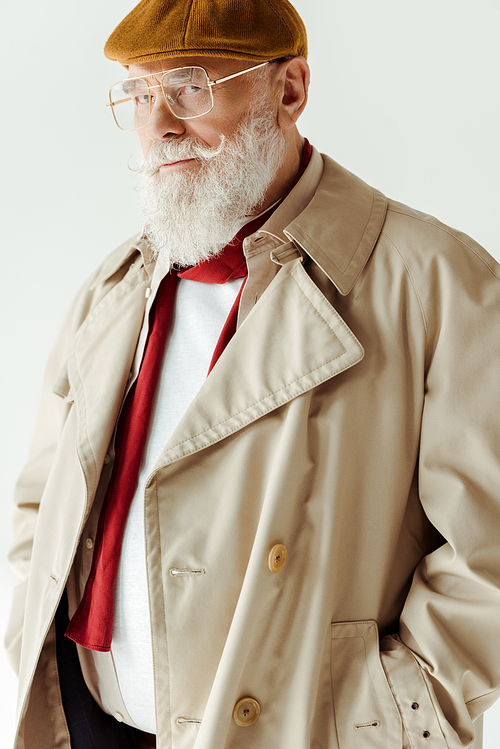 Handsome senior man in beret and sunglasses  isolated on white