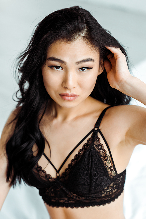 sexy brunette thai woman in lace black bra 