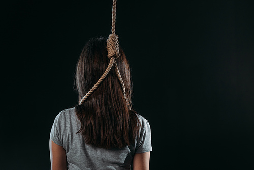 back view of woman with rope noose on neck isolated on black
